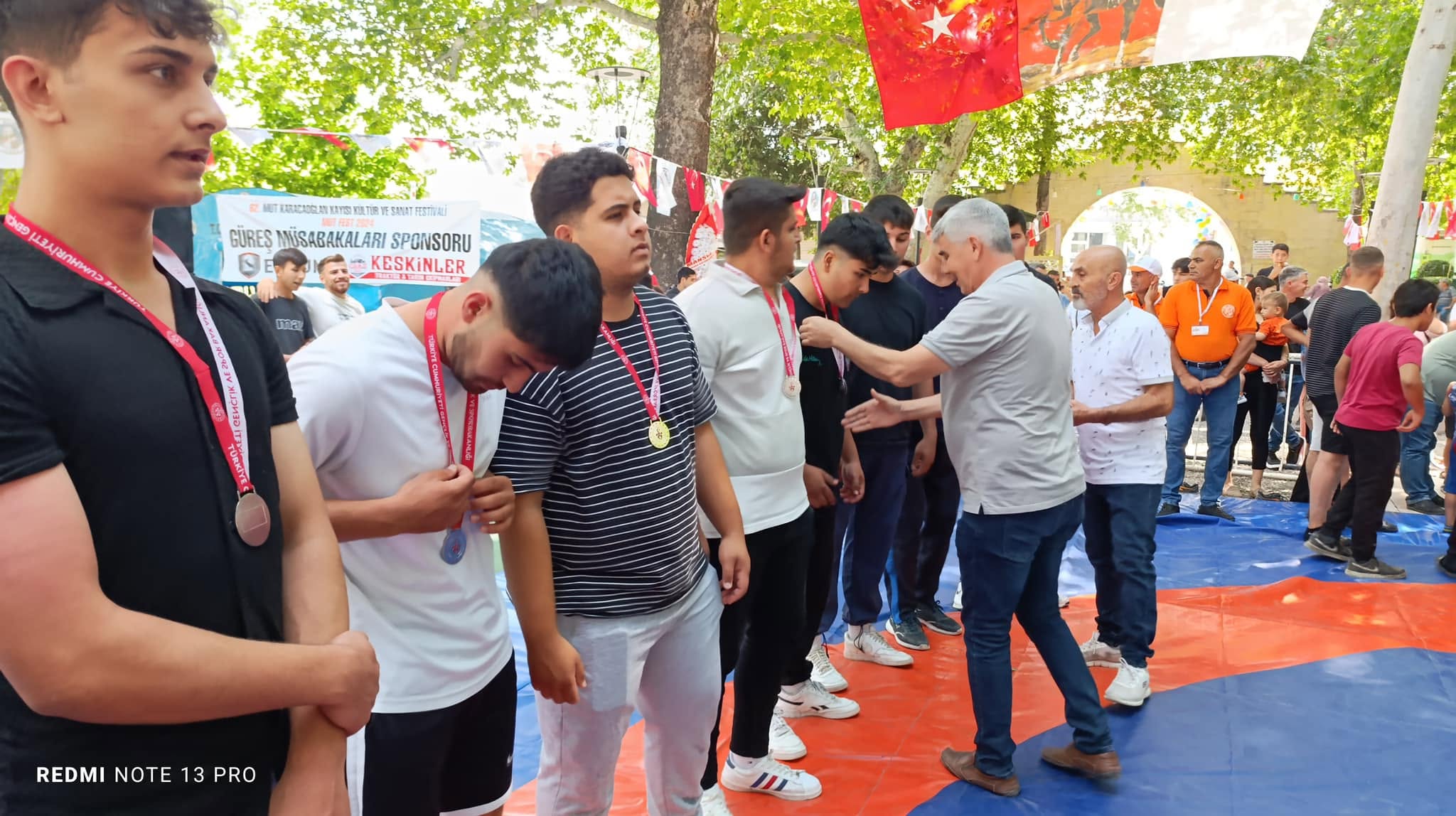 A tug-of-war competition was held at the 62nd Karacaoğlan Apricot, Culture, Arts, and Sports Festival, organized by Mut Municipality and coordinated by Yücel Buğdaycı, our Federation’s Mut District Representative. - 1